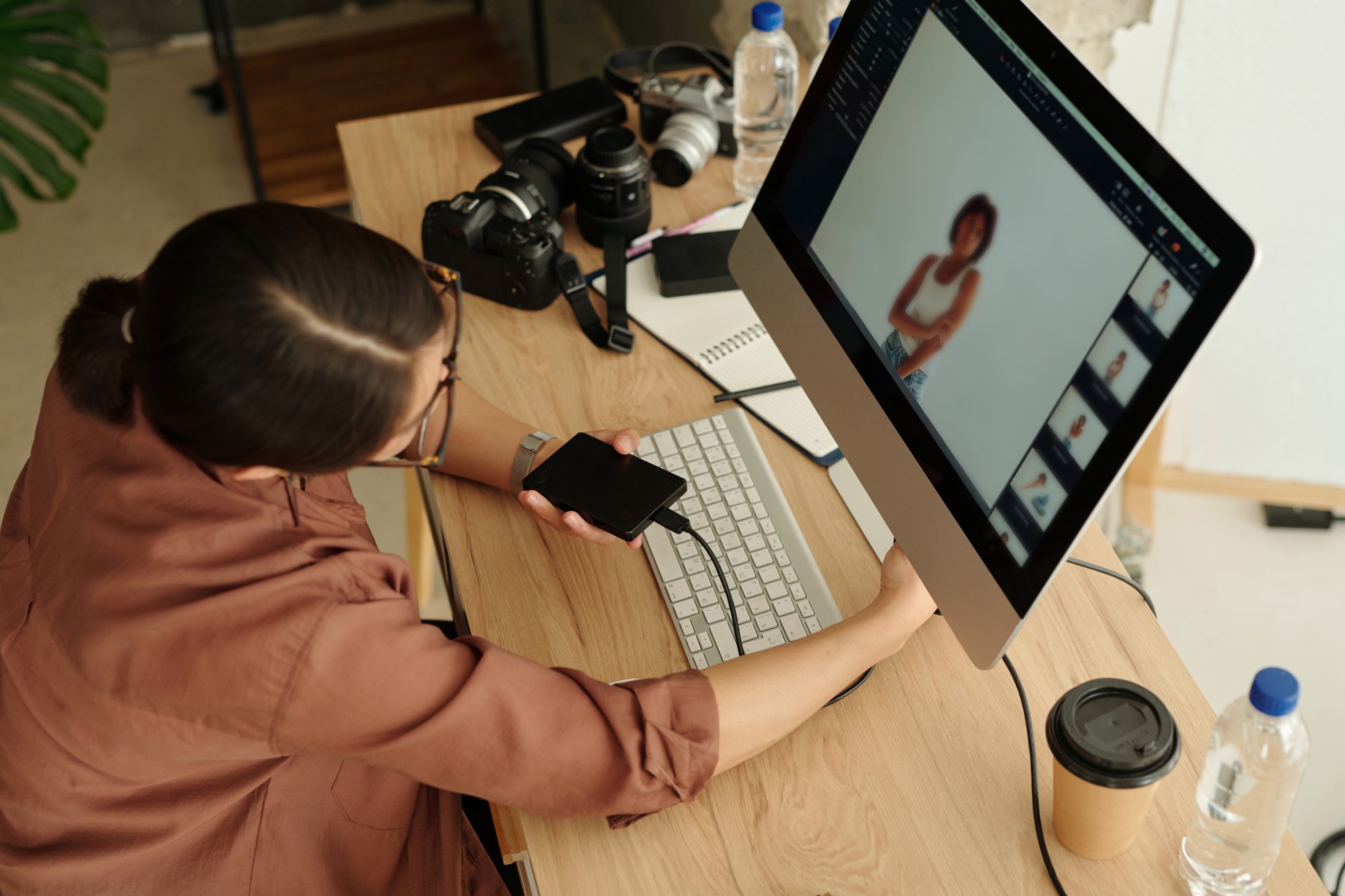 above-angle-of-young-freelance-photographer-sittin-2025-03-14-21-42-39-utc above-angle-of-young-freelance-photographer-sittin-2025-03-14-21-42-39-utc