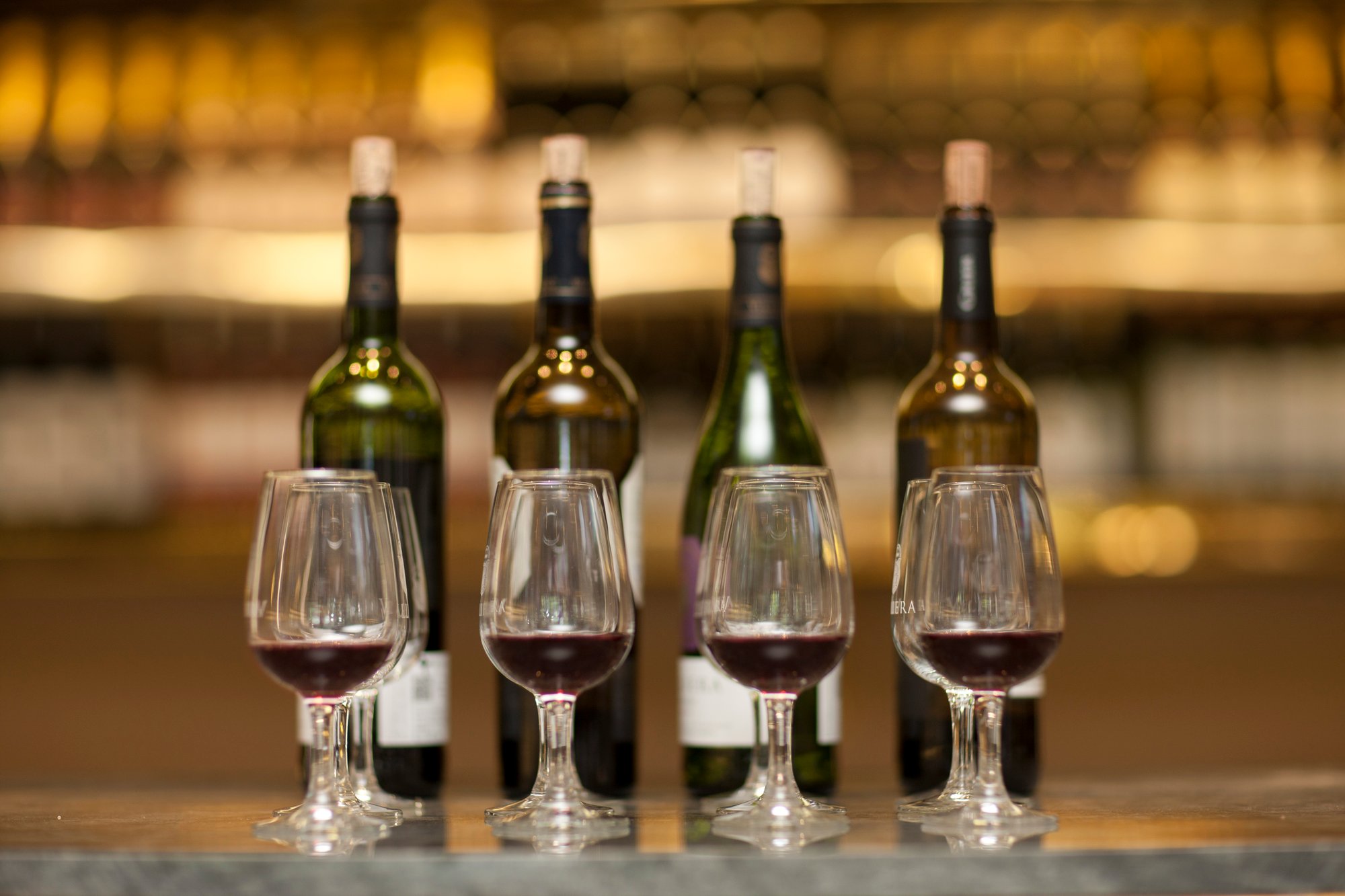 red-wine-glasses-and-wine-bottles-on-a-counter-of-2024-09-23-02-09-08-utc red-wine-glasses-and-wine-bottles-on-a-counter-of-2024-09-23-02-09-08-utc