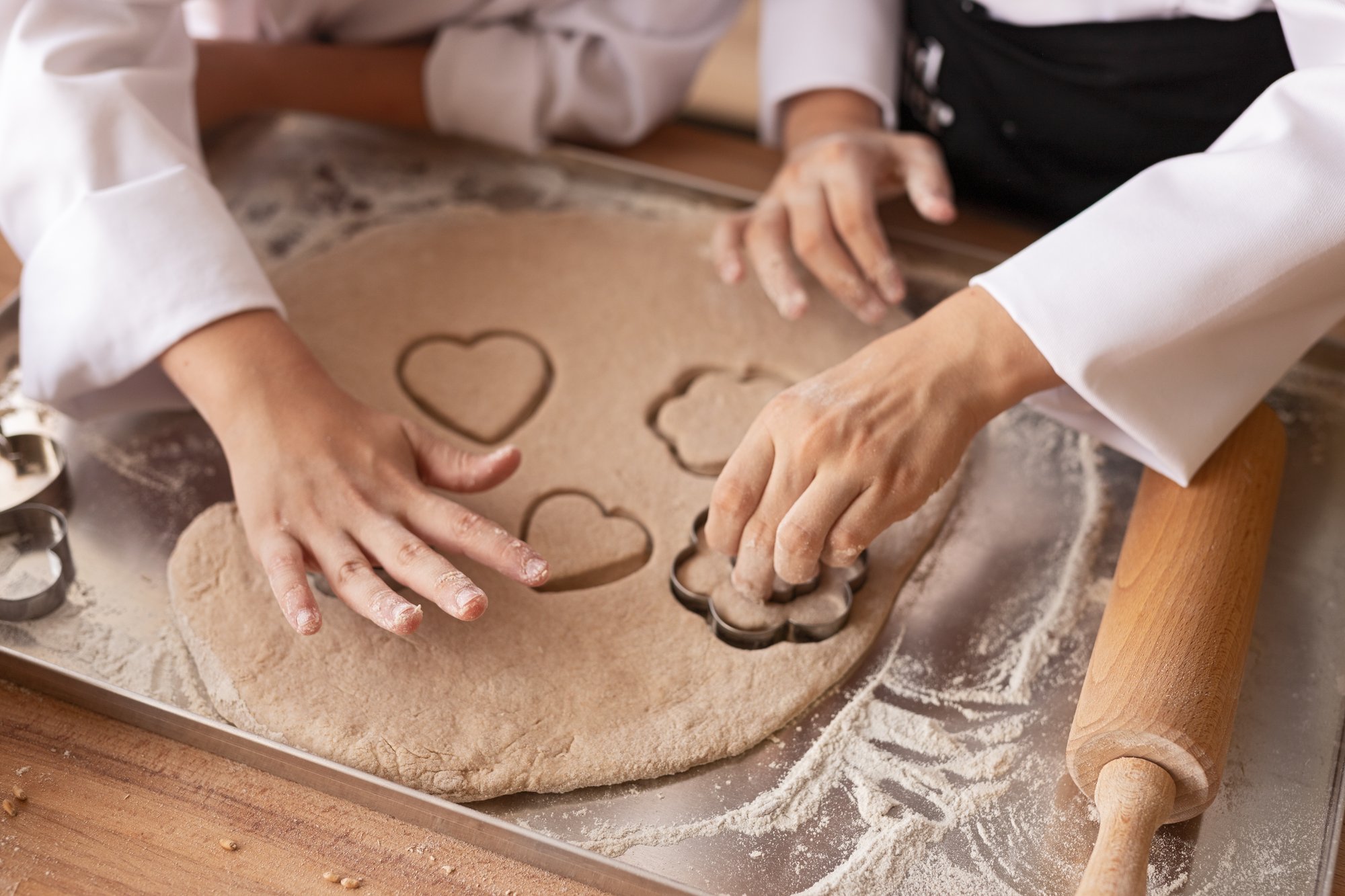 crop-children-cutting-cookies-from-dough-2025-03-15-20-50-36-utc