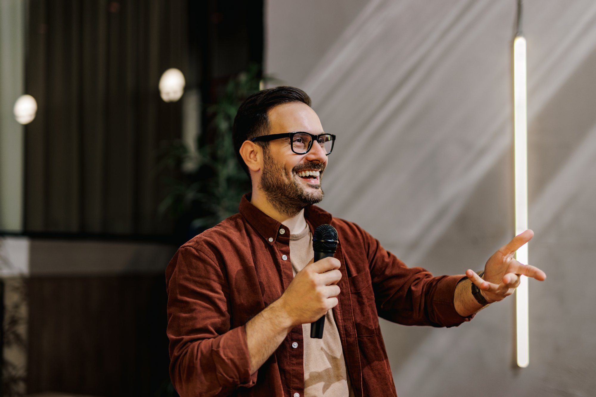 businessman-holding-a-microphone-standing-in-the-2025-09-09-19-44-46-utc