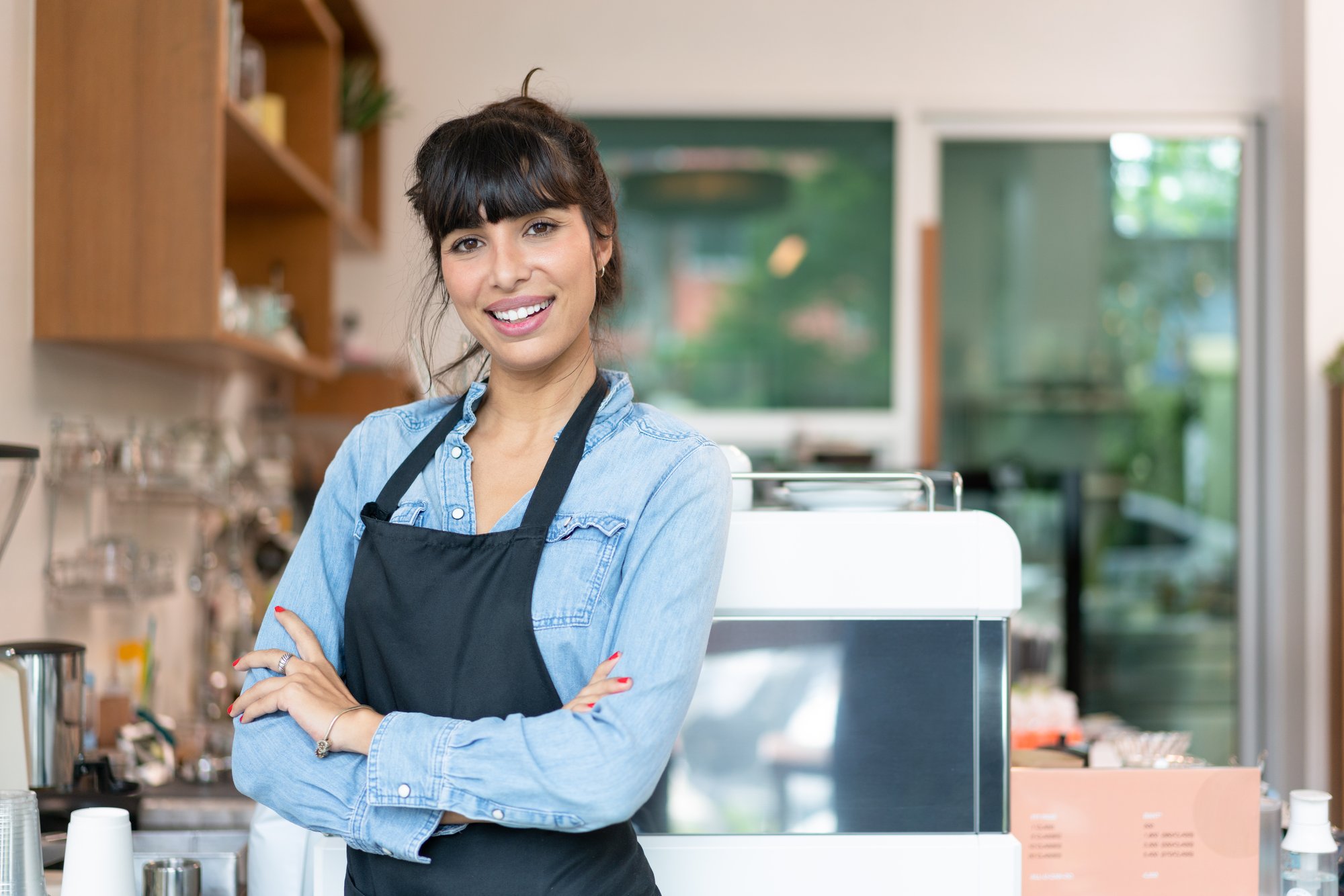 smiling-female-barista-owner-arms-crossed-and-stan-2026-01-07-01-26-32-utc
