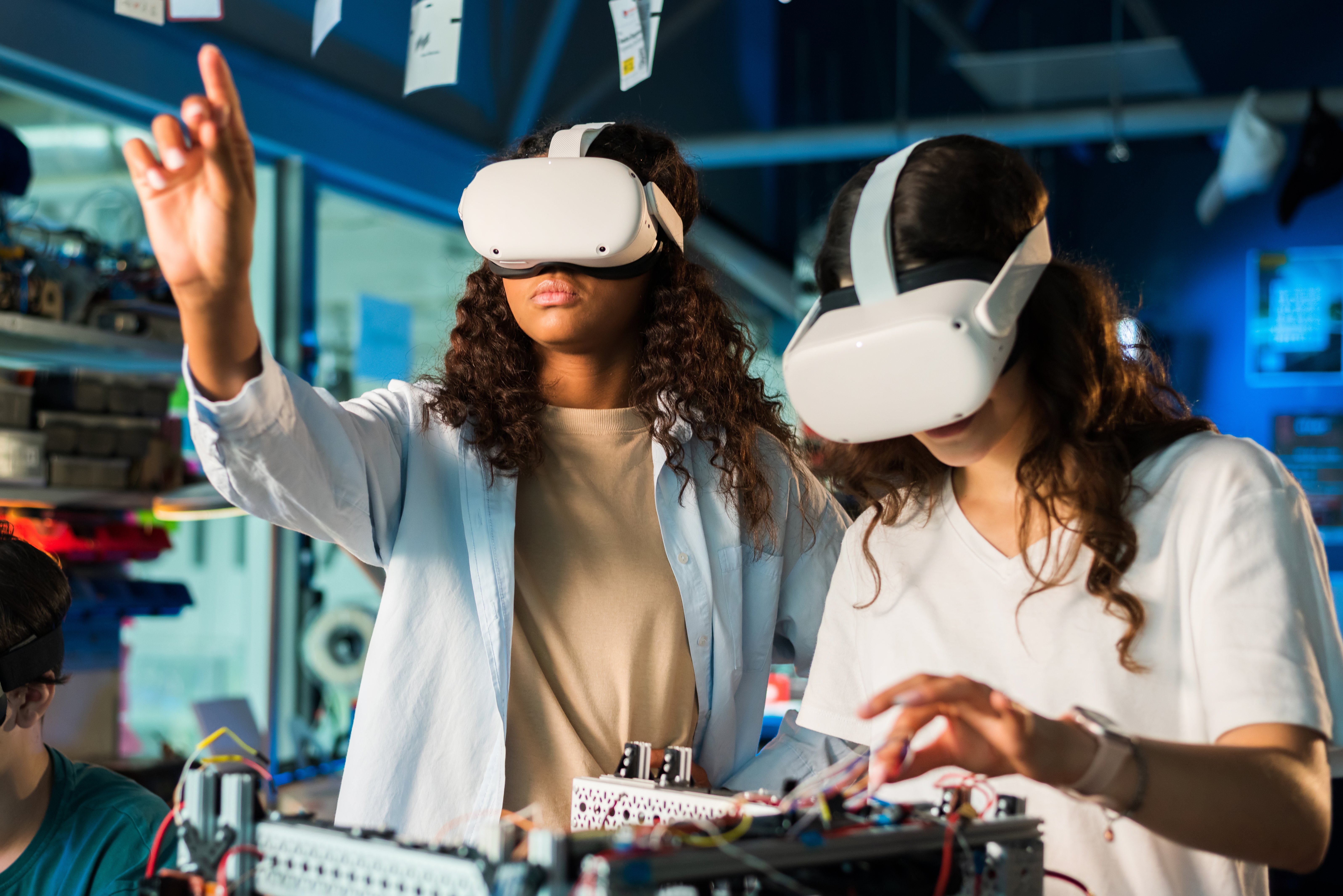 two-young-women-in-vr-glasses-doing-experiments-in-2025-02-19-20-57-44-utc